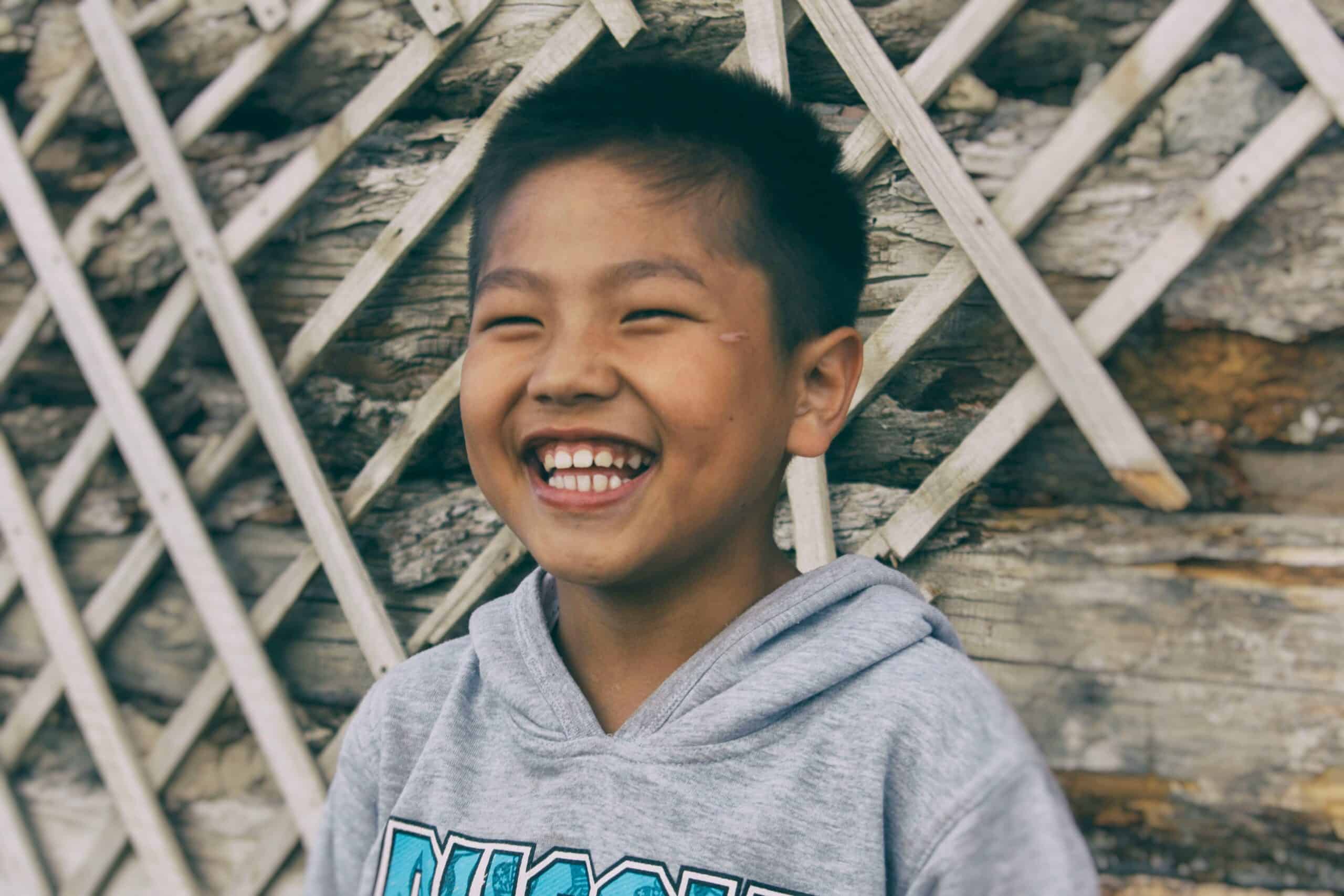 Smiling boy showing his teeth - Periodontist Southern Pines & Sanford NC | Van Scoyoc Periodontics & Implants Smiling boy showing his teeth